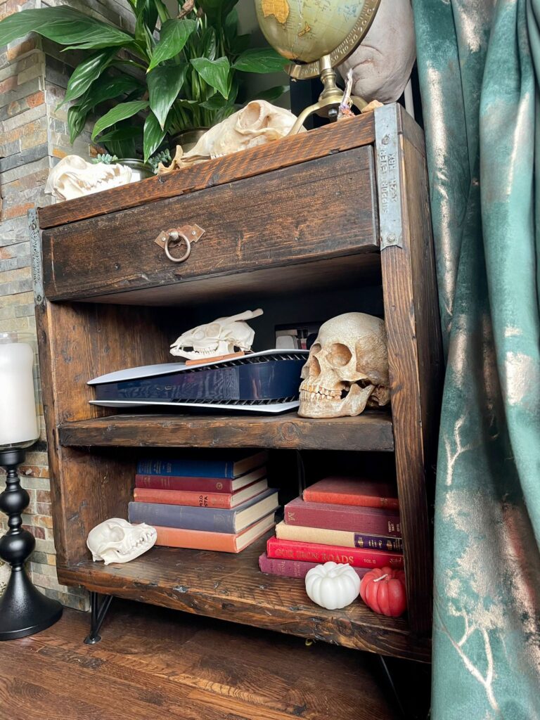 Close up of reclaimed wood bookshelf with vintage decor