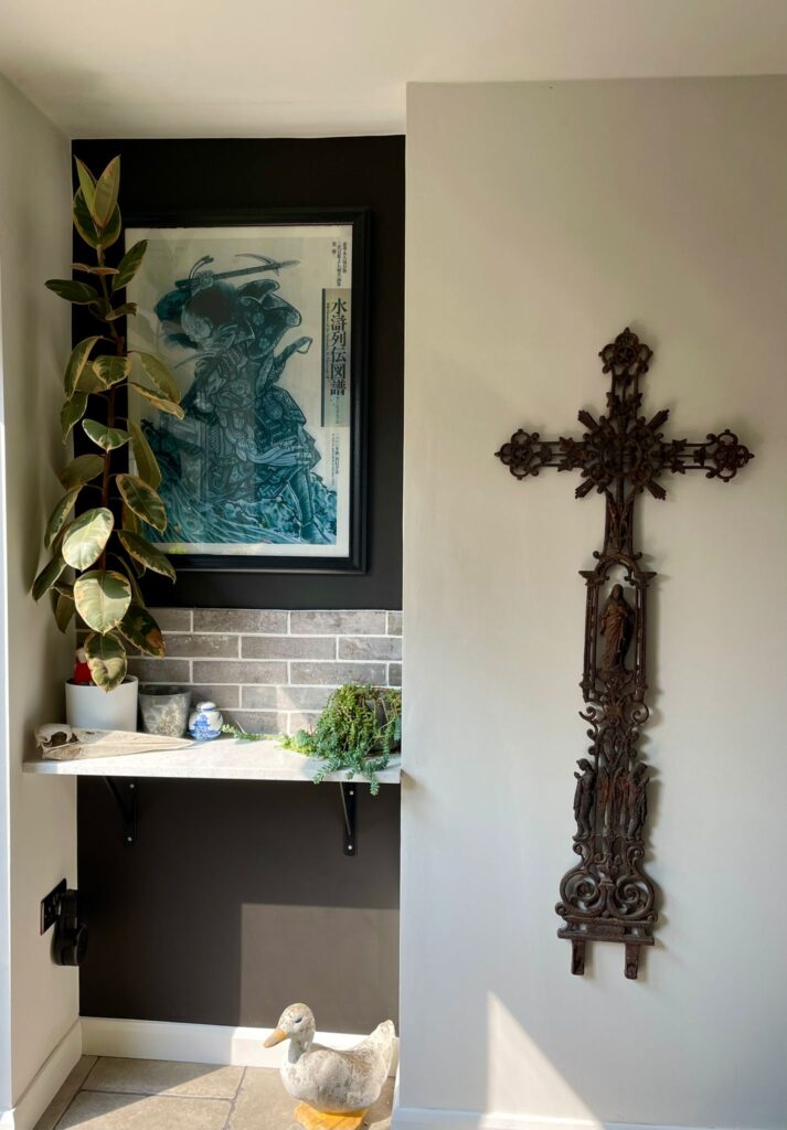 Distressed wooden sideboard with decorative skull and globe